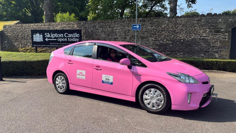 Pink Taxi outside Skipton Castle