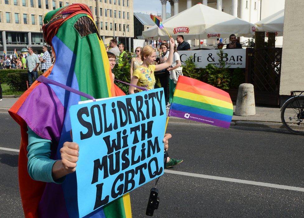 Protester wears rainbow burka in solidarity with Muslim LGBT people, Warsaw 2003