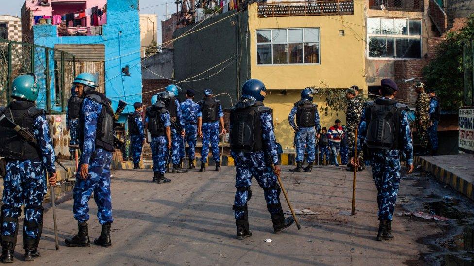 Indian paramilitary forces stand patrol a riot- affected area on March 01, 2020 in New Delhi, India.