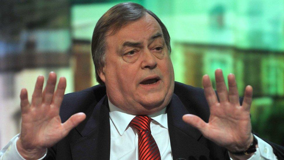 John Prescott holding his hands up while talking