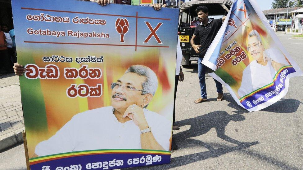 Supporters carrying Gotabaya Rajapaksa posters around Colombo after his win was announced