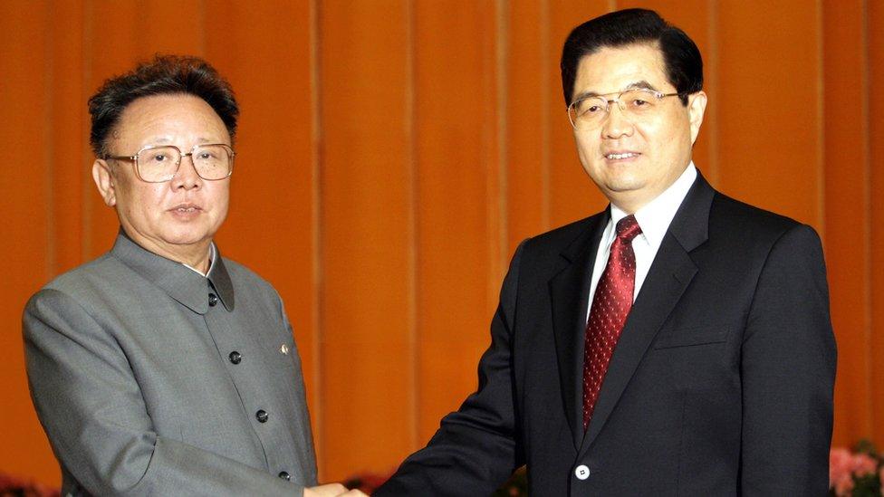 A photo released by China's Xinhua new agency shows Chinese President Hu Jintao (R) shaking hands with North Korean leader Kim Jong-il, inside the Great Hall of the People in Beijing 17 January 2006