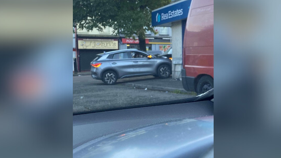 Silver car rammed into Rea Estate agents in Woodvale Belfast