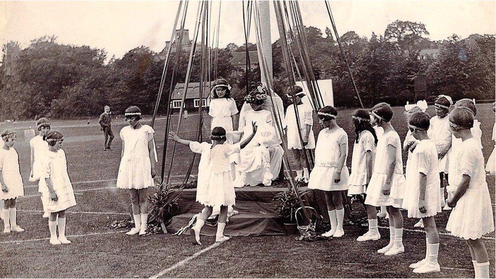 Dancing around the maypole