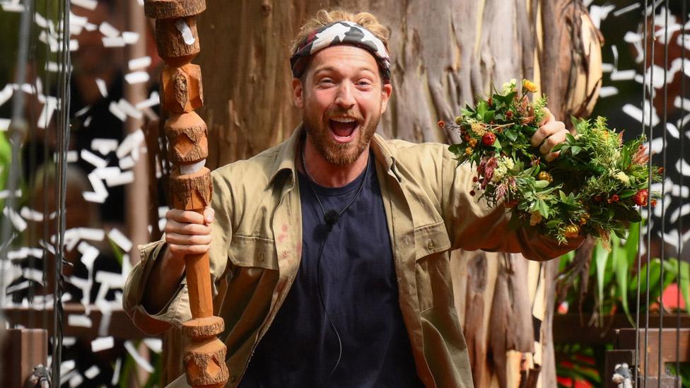 Sam Thompson celebrating his win on I'm A Celebrity