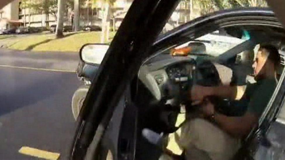 Police officer filmed punching woman on New Jersey beach BBC News(01)