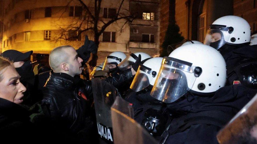 Police block Damjan Knezevic, leader of the far-right People's Patrol and protesters who attempted to storm the New Palace, the seat of President of Serbia