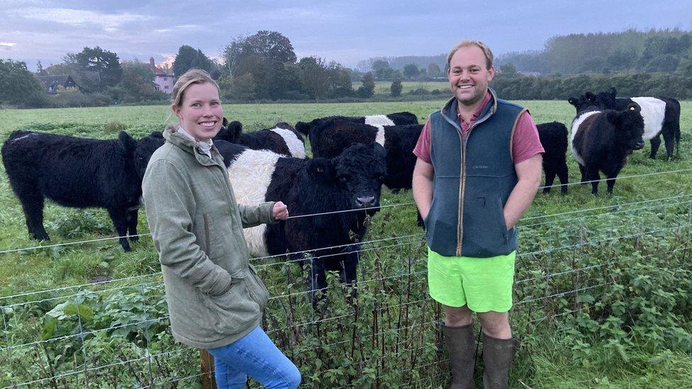 Farmers Livvy Colton and Lewis Gidney with their cows