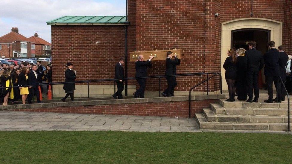 Charlie Pope's coffin being carried into church