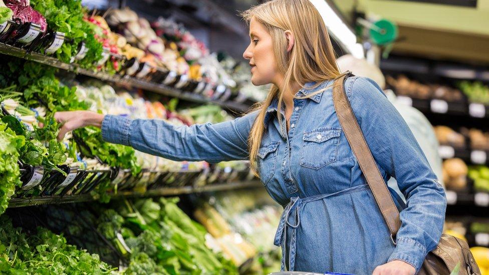 Woman buying salad