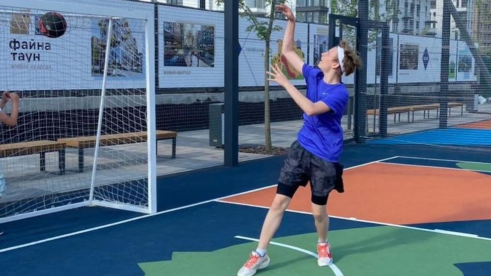 Max playing basketball in Kyiv