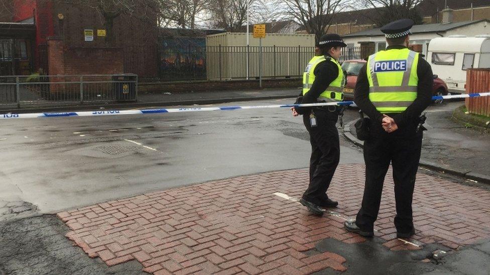 Police officers and tape