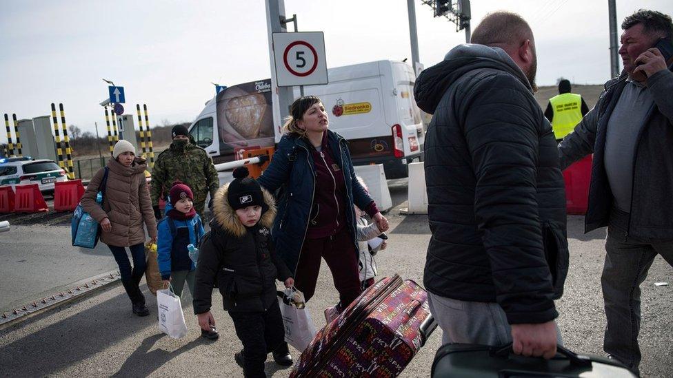 Refugees arriving at the Polish border of Medyka