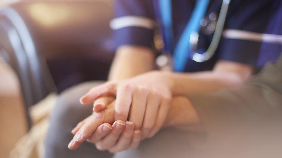 nurses comforts patient