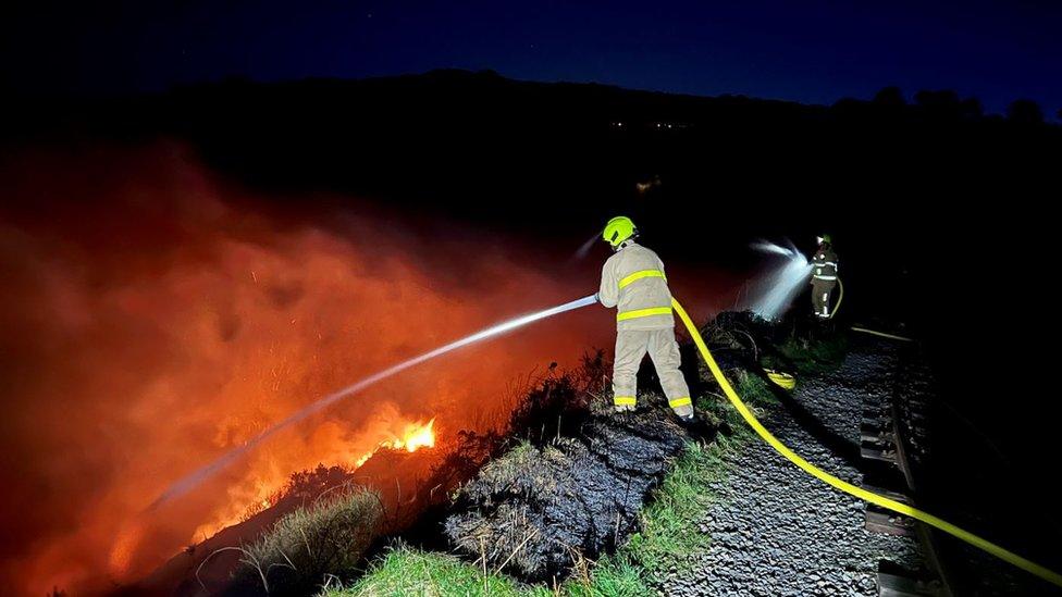 Firefighter tackling the blaze