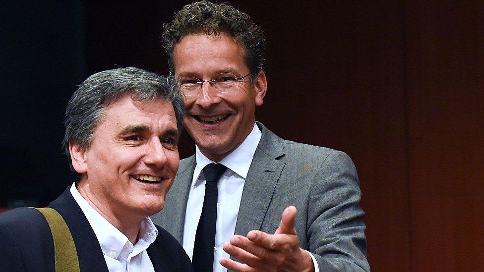 Greek Finance Minister Euclid Tsakalotos (L) talks with Dutch Finance Minister and president of the Eurogroup Jeroen Dijsselbloem