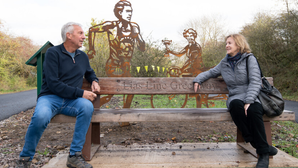 David Moorcroft and Eileen Sheridan with their statues