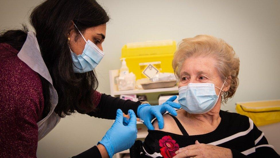 A vaccination being administered in a branch of Boots in Halifax