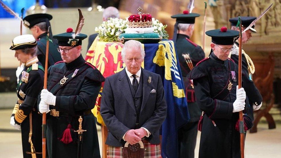 King Charles stands with his siblings beside the Queen's coffin