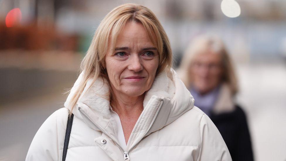 Nurse Sandie Peggie wearing a white winter jacket. She has blonde hair.