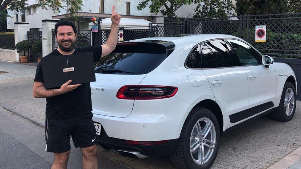 Rhys Williams with a porsche car