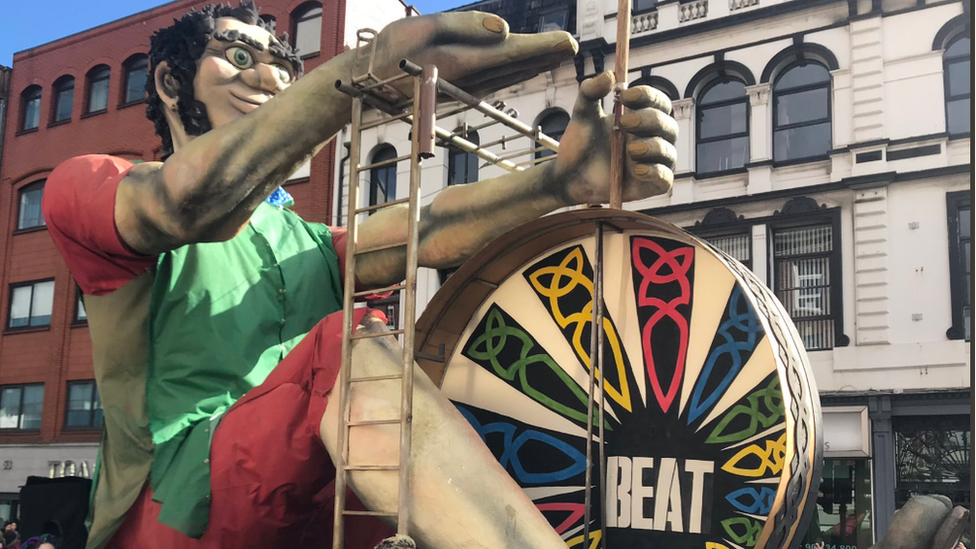 A giant bodhrán player was part of Belfast's St Patrick's day parade