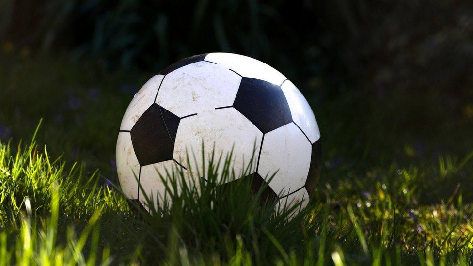 A football in the grass