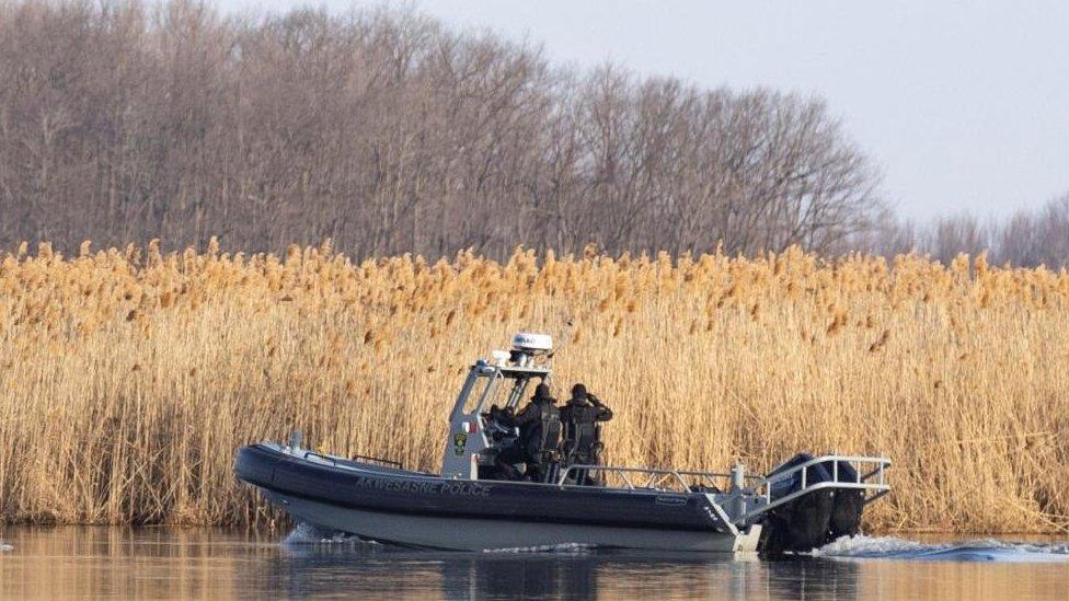 Police search the marshland where bodies were found in Akwesasne, Quebec, Canada March 31, 2023.