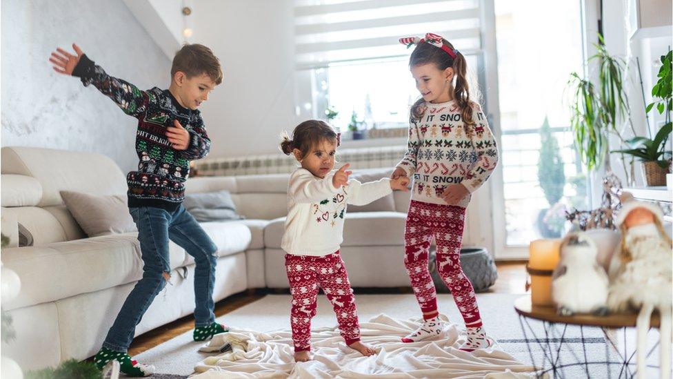 Kids dancing to Christmas music