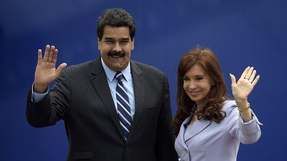 Argentina's President Cristina Fernandez (right) and Venezuela's Nicolas Maduro wave during the 47th Mercosur Summit family photo, in Parana, Entre Rios, Argentina on 17 December, 2014.