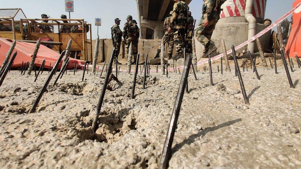 Iron nails embedded in the road at Tikri