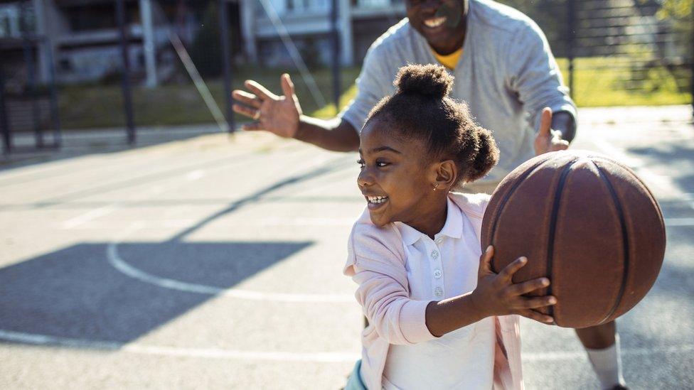 child with basketball