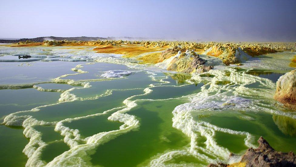 dallol ethiopia's hydrothermal springs in bright green and white and yellow