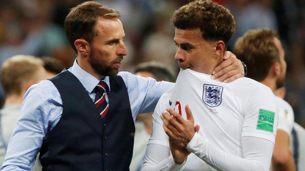 Gareth Southgate and Dele Alli standing together after England's World Cup loss