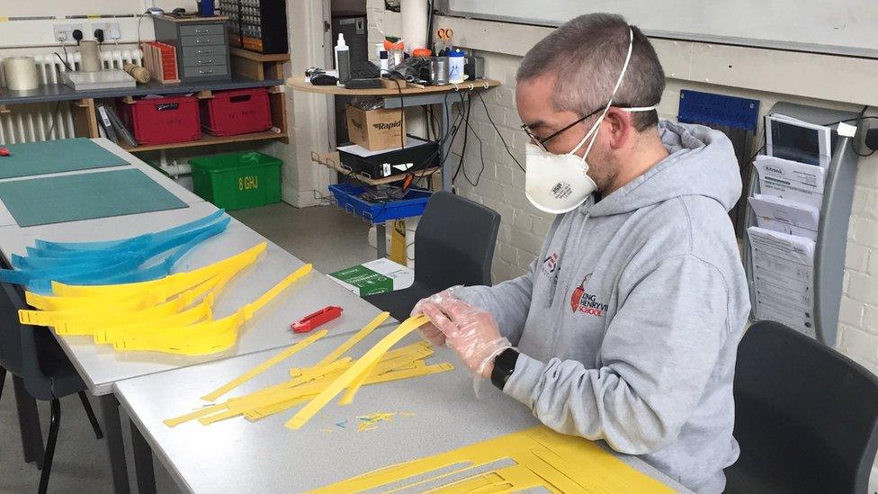 Stuart Sweetman making the masks