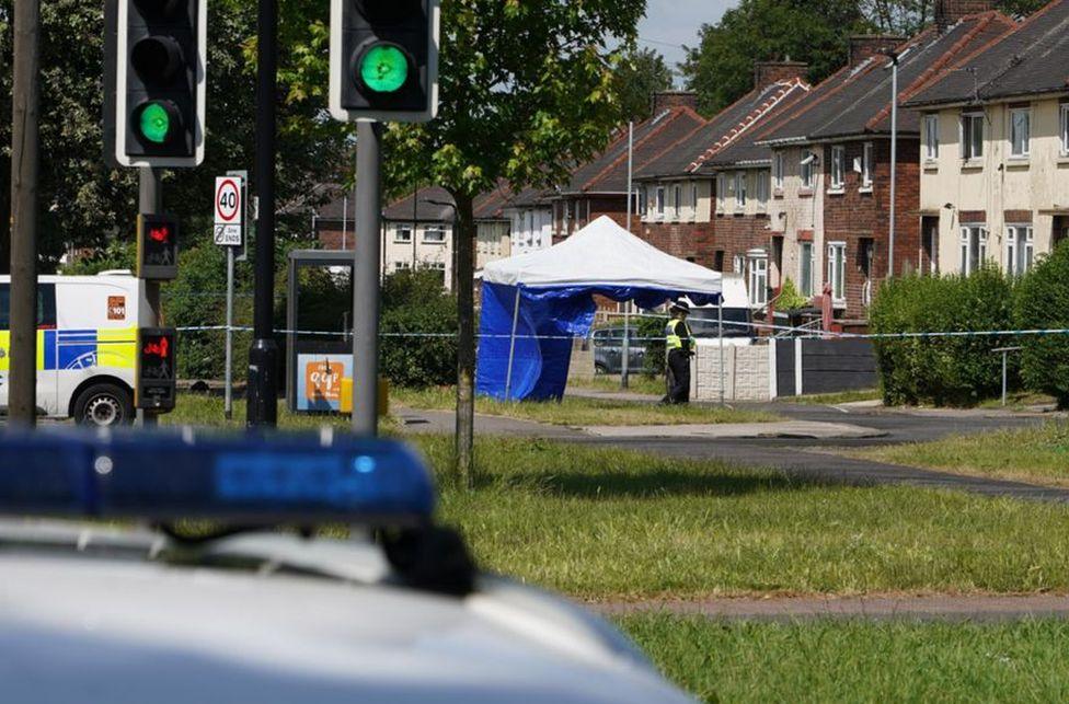 A police forensic tent set up on a street in Rotherham