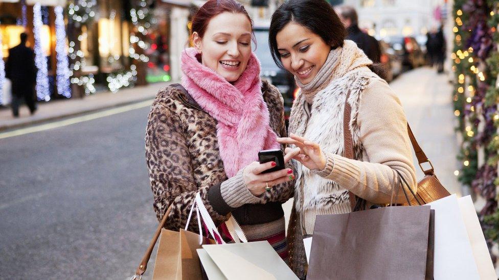 Two women Christmas shopping