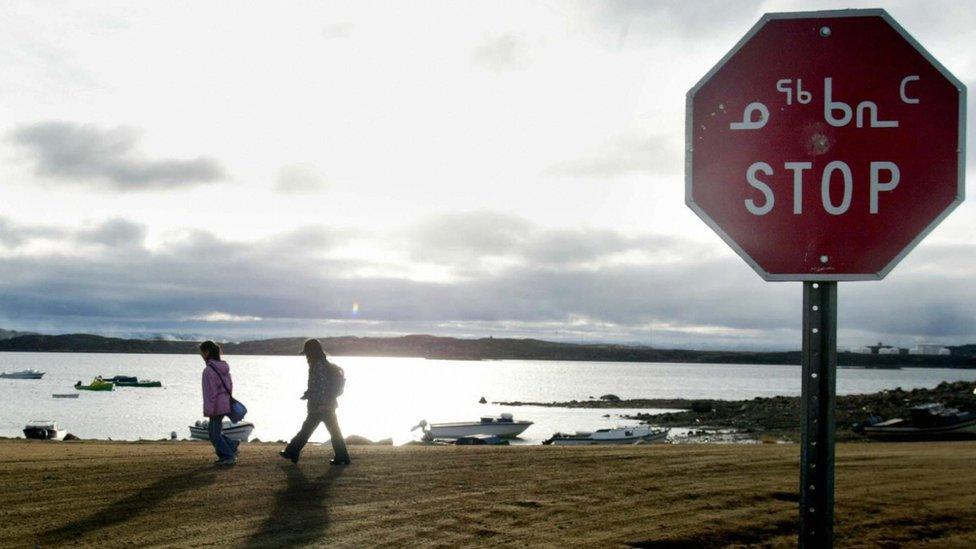 A stop sign in Iqaluit, the capital of the Canadian territory of Nunavut, is written in English and the syllabary form of the Inuktitut language.