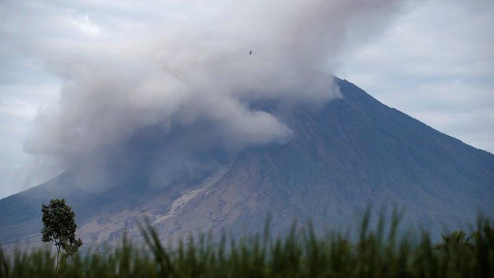 Mount Semeru volcano spews volcanic ash and smoke