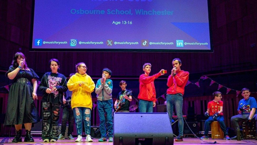 The youth rock group Rubik's Cube performing on stage