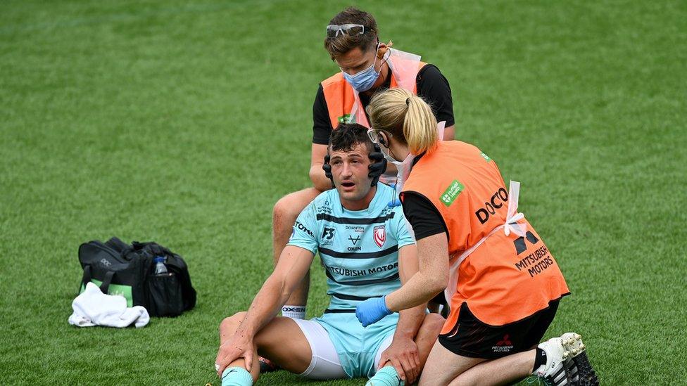 Jonny May of Gloucester Rugby receives medical treatment