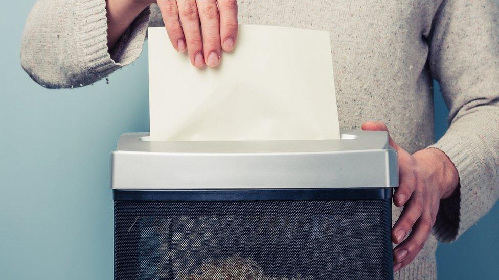 Documents in a shredder