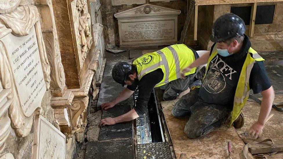 the final stone to be installed in the restoration of Bath Abbey's historic floor