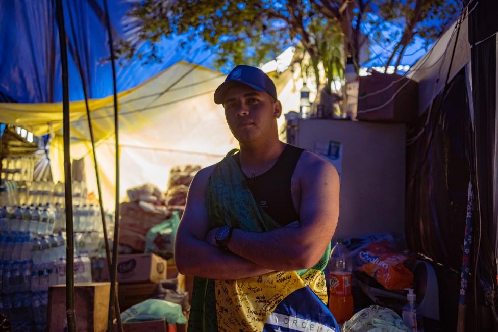 Rodrigo poses for a photo outside one of the tents