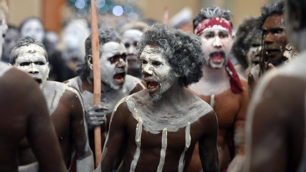 Aboriginal dancers prepare for the event Arms Against Domestic Violence at Parliament House in Canberra