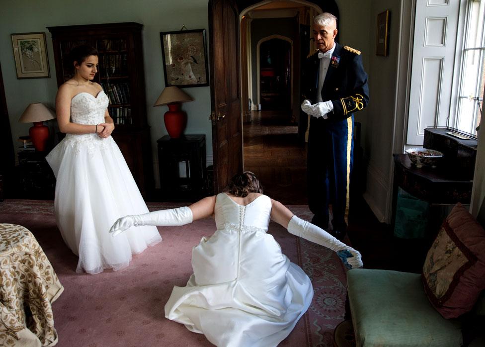 A debutante practices her dip curtsy at Boughton Monchelsea Place ahead of the Queen Charlotte's Ball on September 9, 2017 in Maidstone, England