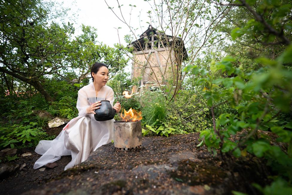 Designer Jihae Hwang in her Korean inspired garden, A Letter From a Million Years Past during the RHS Chelsea Flower Show press day, at the Royal Hospital Chelsea, London.