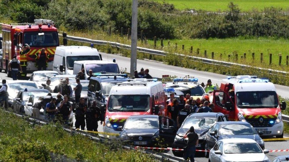 Scene on motorway outside Paris after a BMW driver is shot and arrested following an attack on soldiers earlier in the day, 9 August 2017