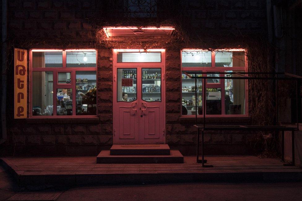 Neon lights outside a convenience store