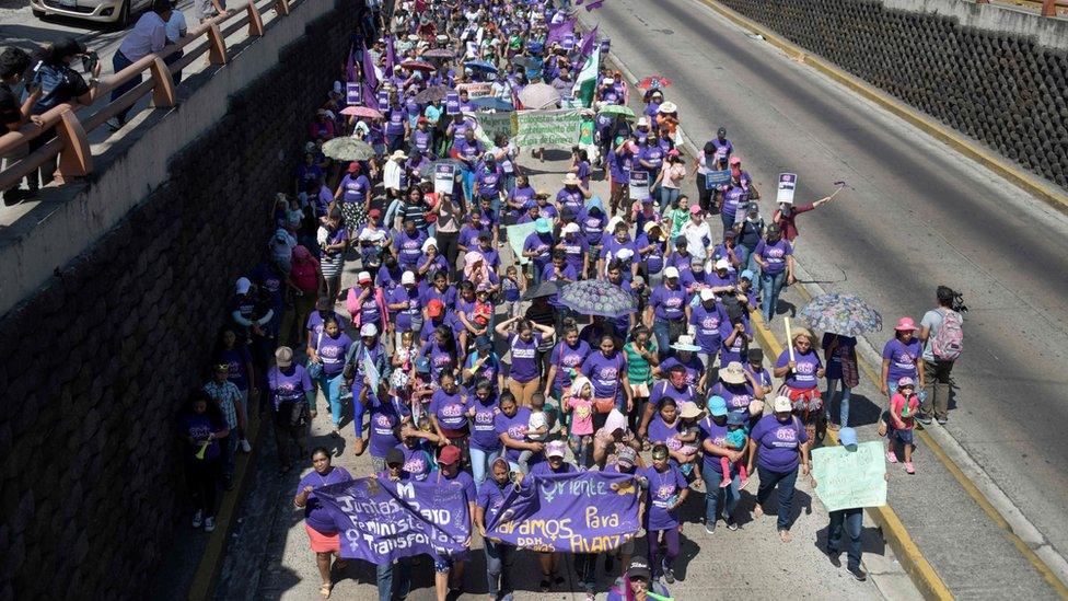 Women march to celebrate the International Women's Day in San Salvador